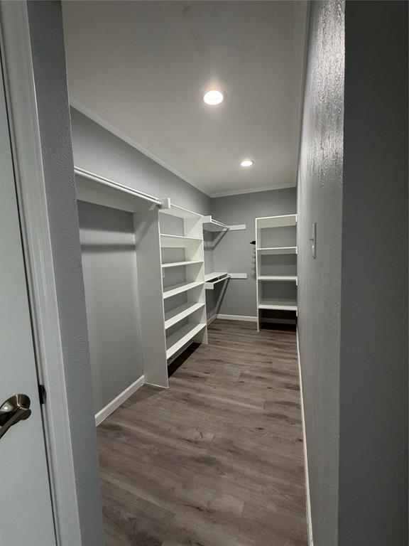 2038 Rose Hill Road Carrollton, TX 75007 - Photo 17 of 35 a view of walk in closet with empty racks
