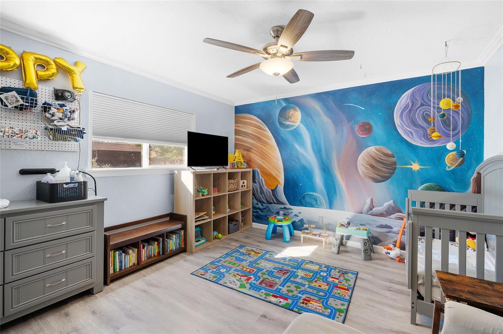 2038 Rose Hill Road Carrollton, TX 75007 - Photo 22 of 35 a living room with furniture and paintings on the wall