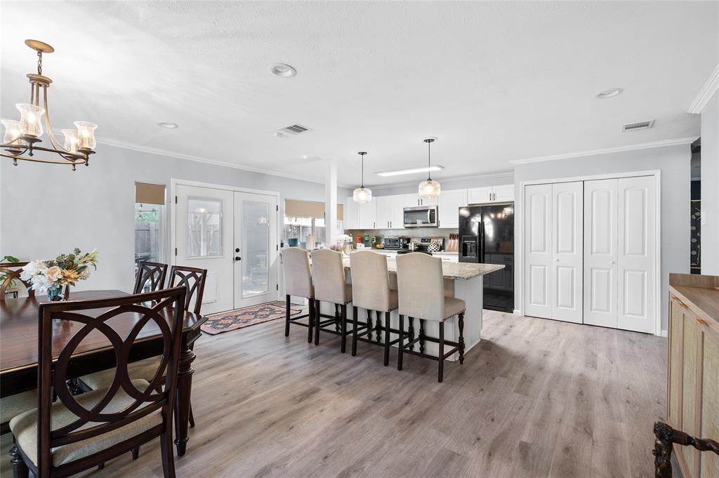 2038 Rose Hill Road Carrollton, TX 75007 - Photo 4 of 35 a dining room with furniture and wooden floor