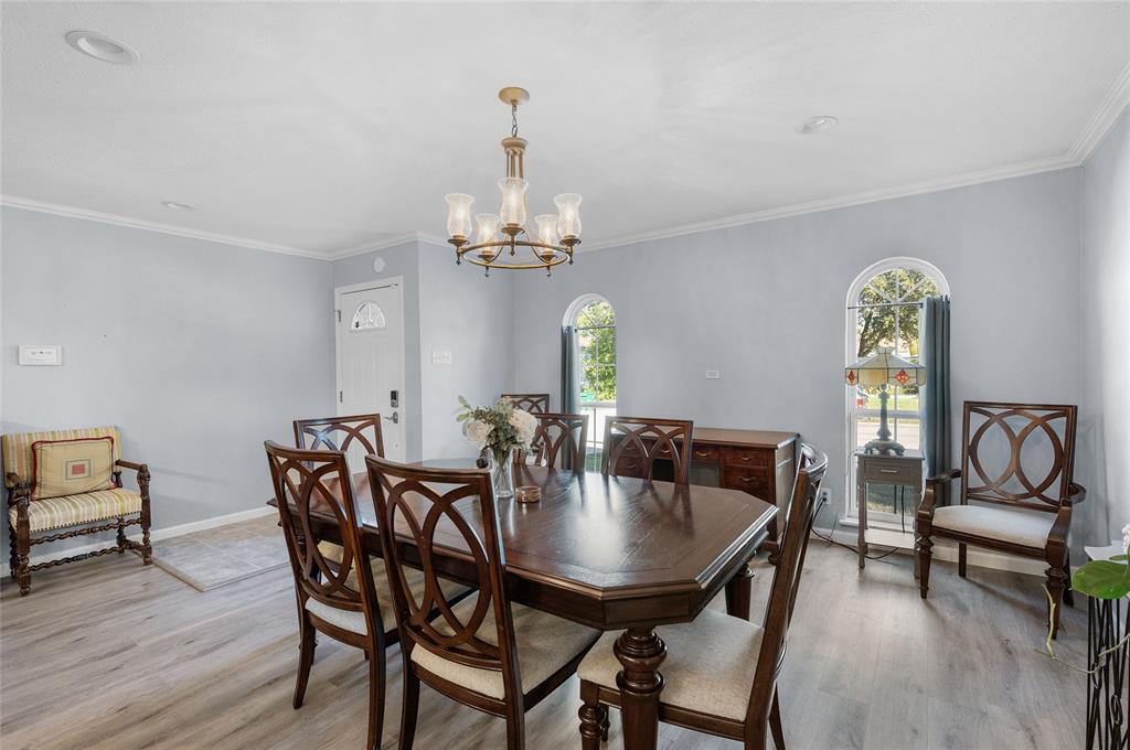 2038 Rose Hill Road Carrollton, TX 75007 - Photo 5 of 35 a view of a dining room with furniture and wooden floor