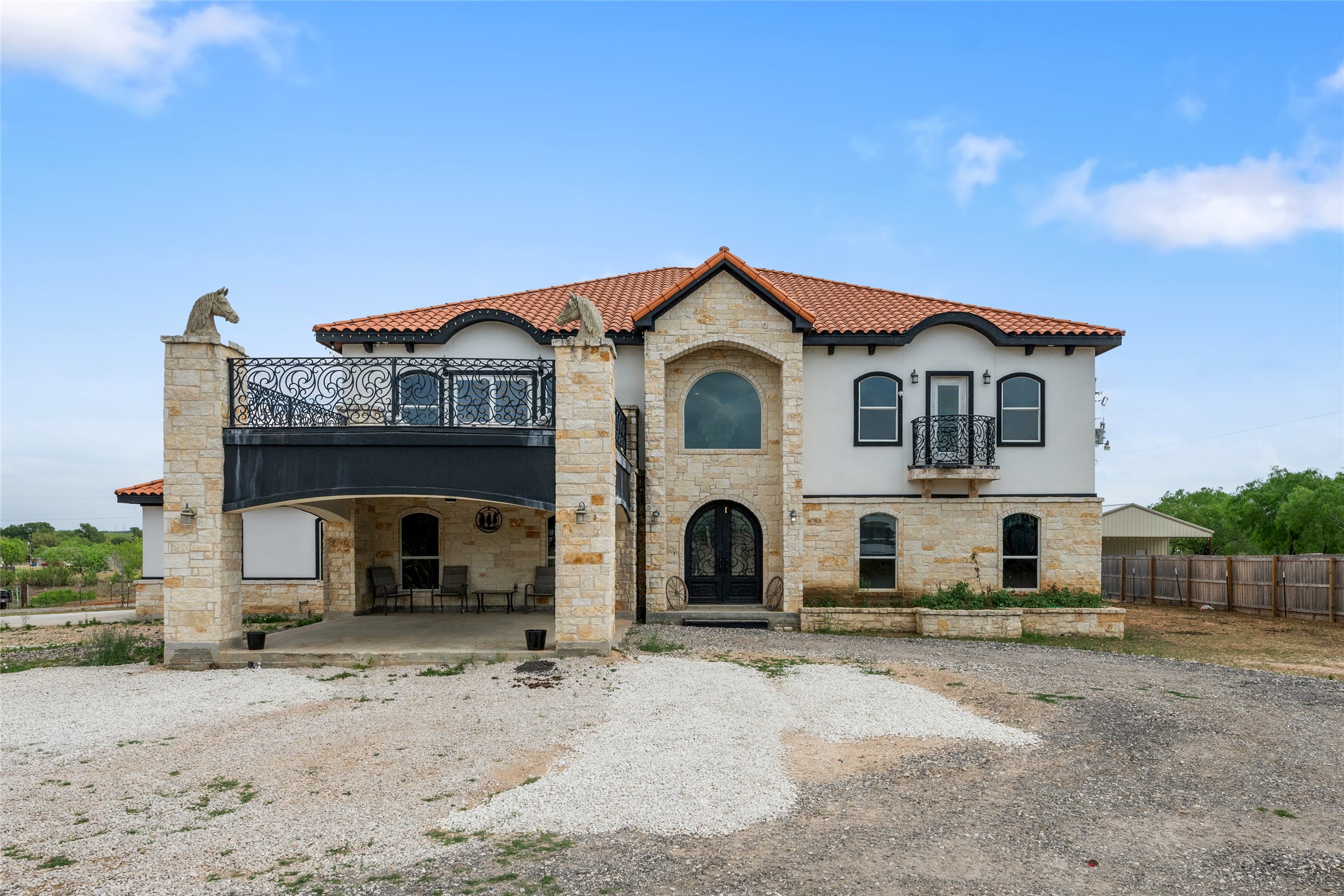 507 Rawhide Road Seguin, TX 78155 - Photo 1 of 40 Mediterranean / spanish-style house featuring stone siding, a tile roof, and stucco siding