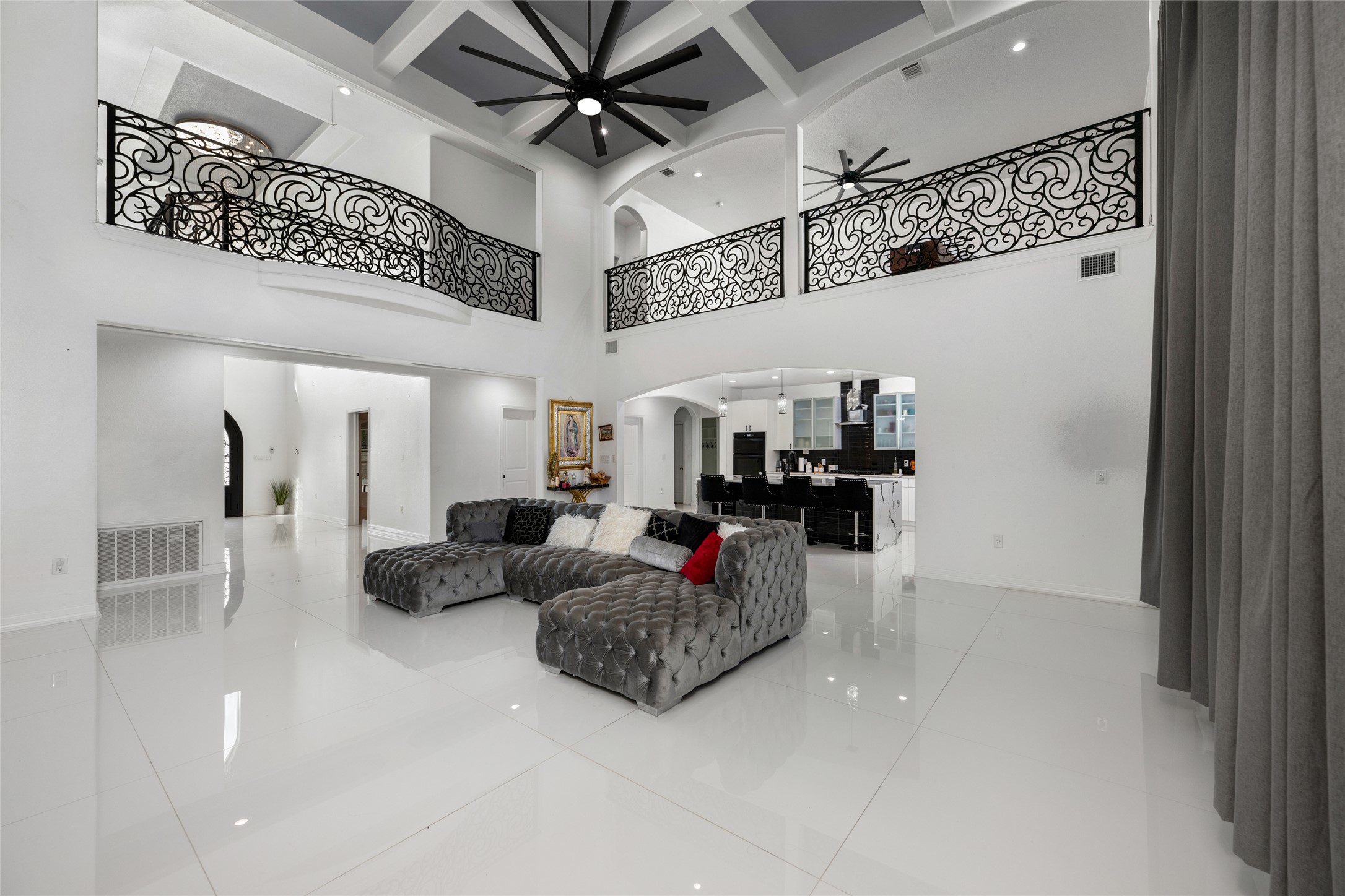 507 Rawhide Road Seguin, TX 78155 - Photo 12 of 40 Living room featuring arched walkways, recessed lighting, a ceiling fan, and light tile patterned floors