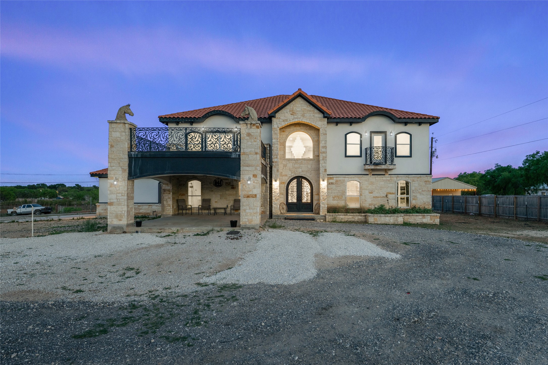 507 Rawhide Road Seguin, TX 78155 - Photo 2 of 40 Mediterranean / spanish-style home featuring stone siding, a tiled roof, and stucco siding