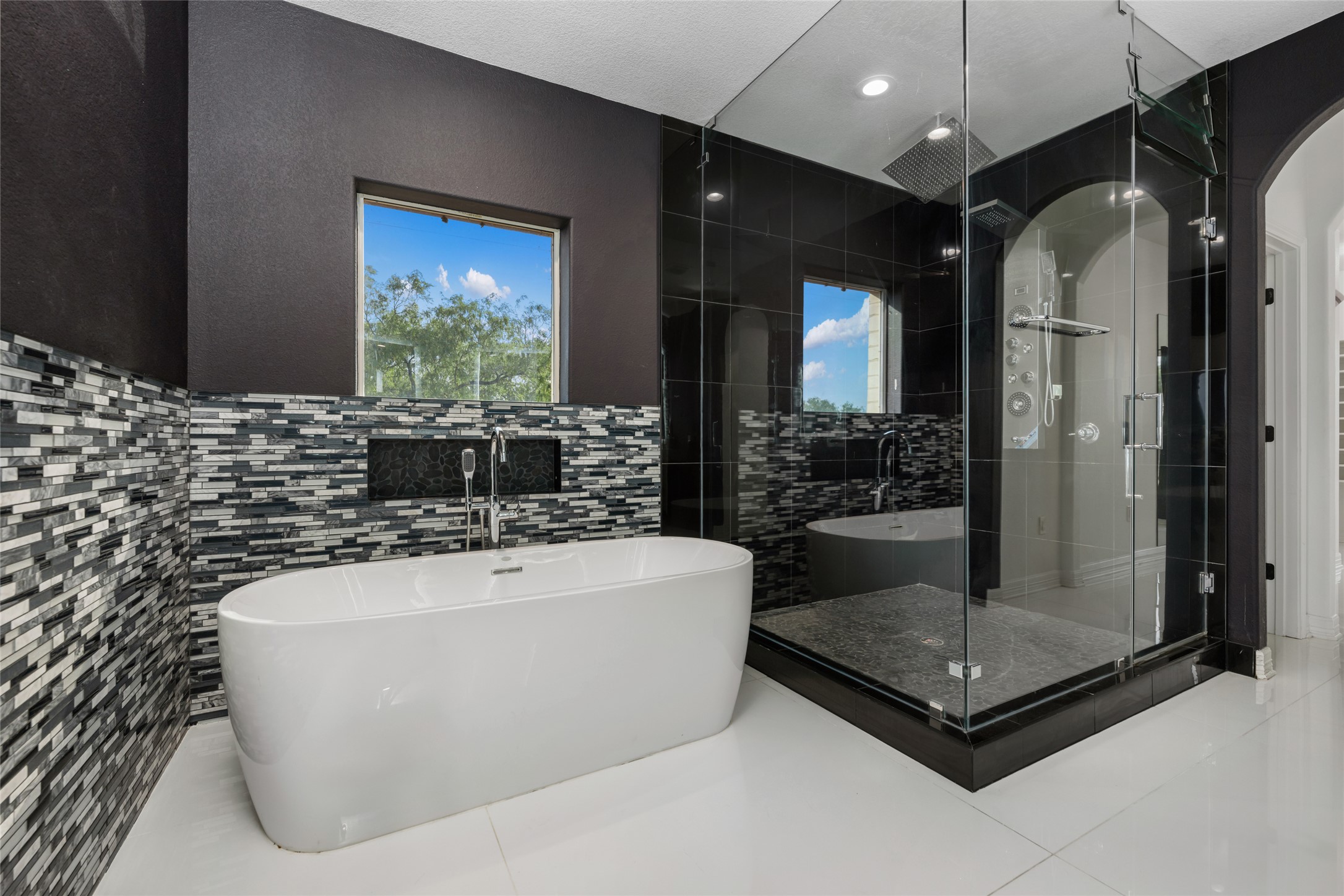 507 Rawhide Road Seguin, TX 78155 - Photo 19 of 40 Full bath featuring a freestanding tub, a stall shower, and tile walls