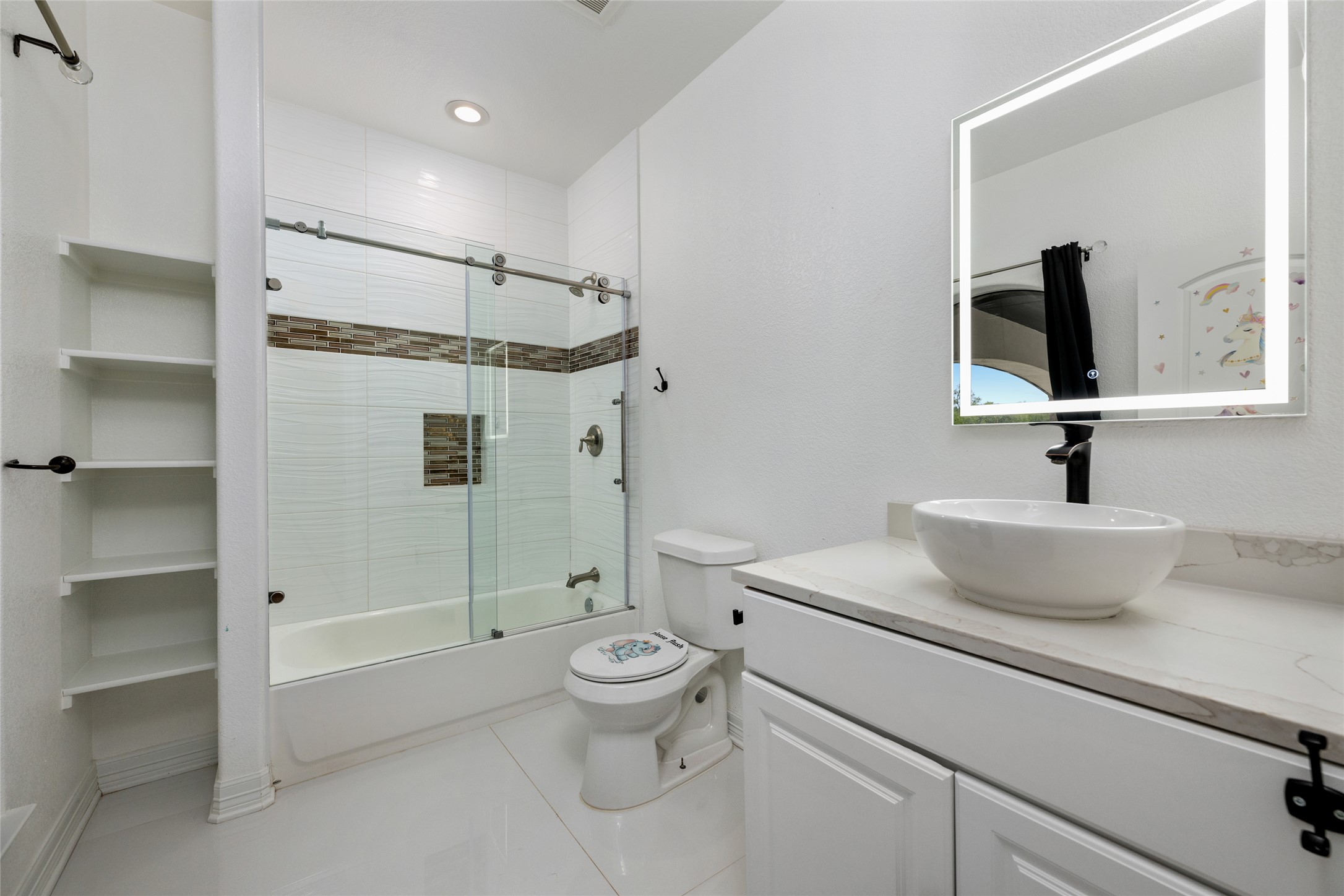 507 Rawhide Road Seguin, TX 78155 - Photo 22 of 40 Full bath with vanity, shower / bath combination with glass door, and light tile patterned floors