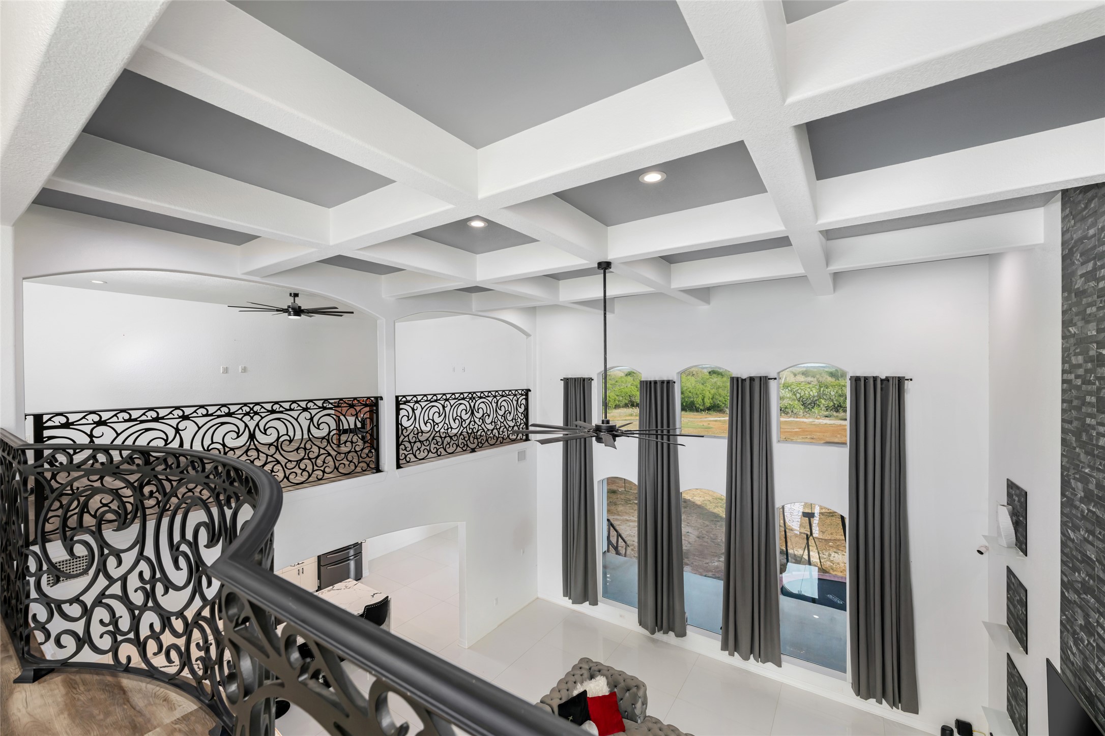 507 Rawhide Road Seguin, TX 78155 - Photo 25 of 40 Corridor featuring coffered ceiling, recessed lighting, and light tile patterned floors