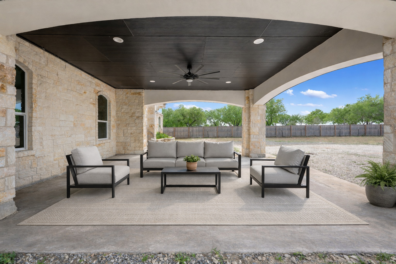 507 Rawhide Road Seguin, TX 78155 - Photo 5 of 40 Fenced backyard featuring ceiling fan, a patio area, and an outdoor lounge area