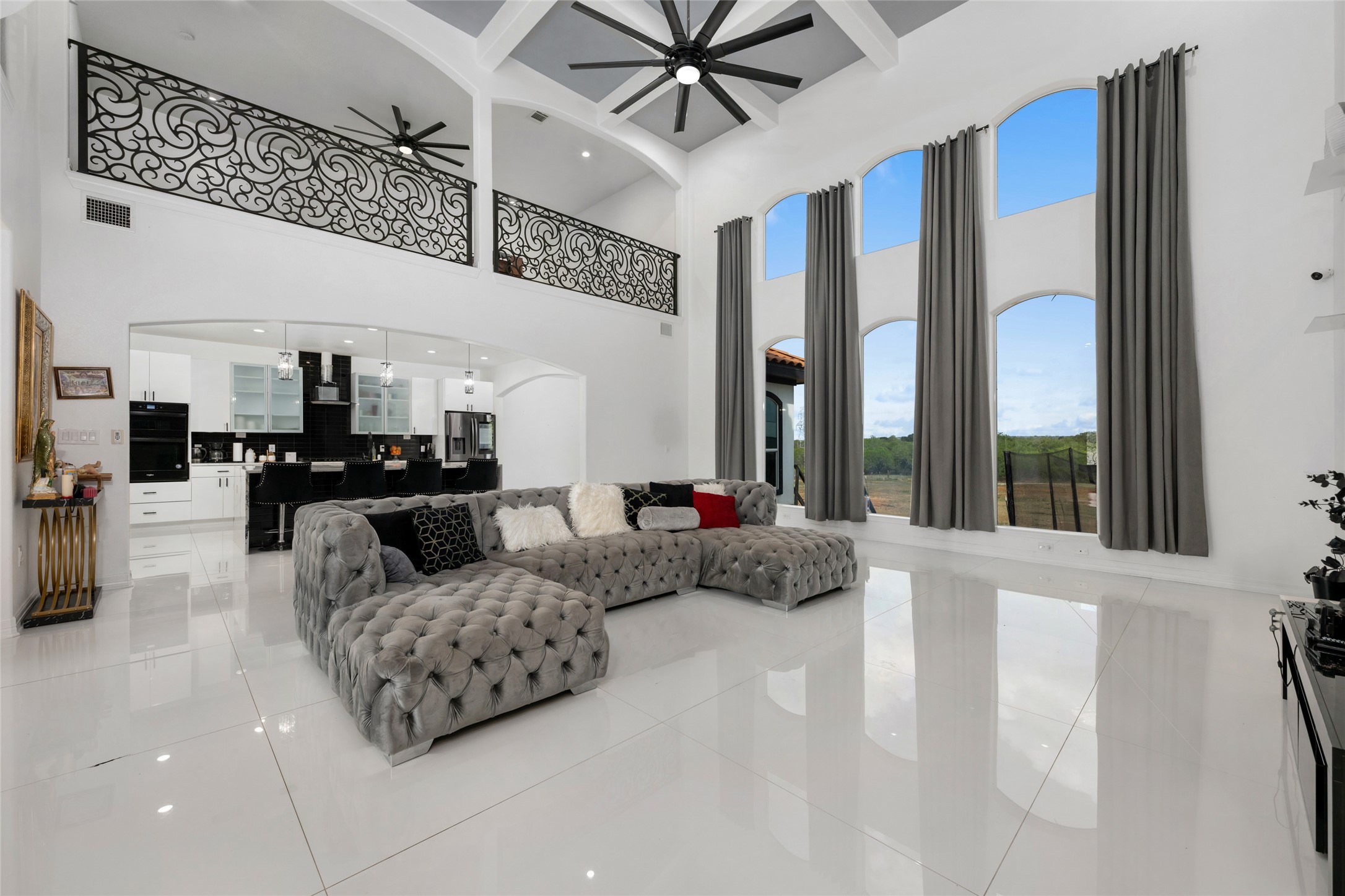 507 Rawhide Road Seguin, TX 78155 - Photo 9 of 40 Living area with arched walkways, light tile patterned floors, a ceiling fan, and recessed lighting