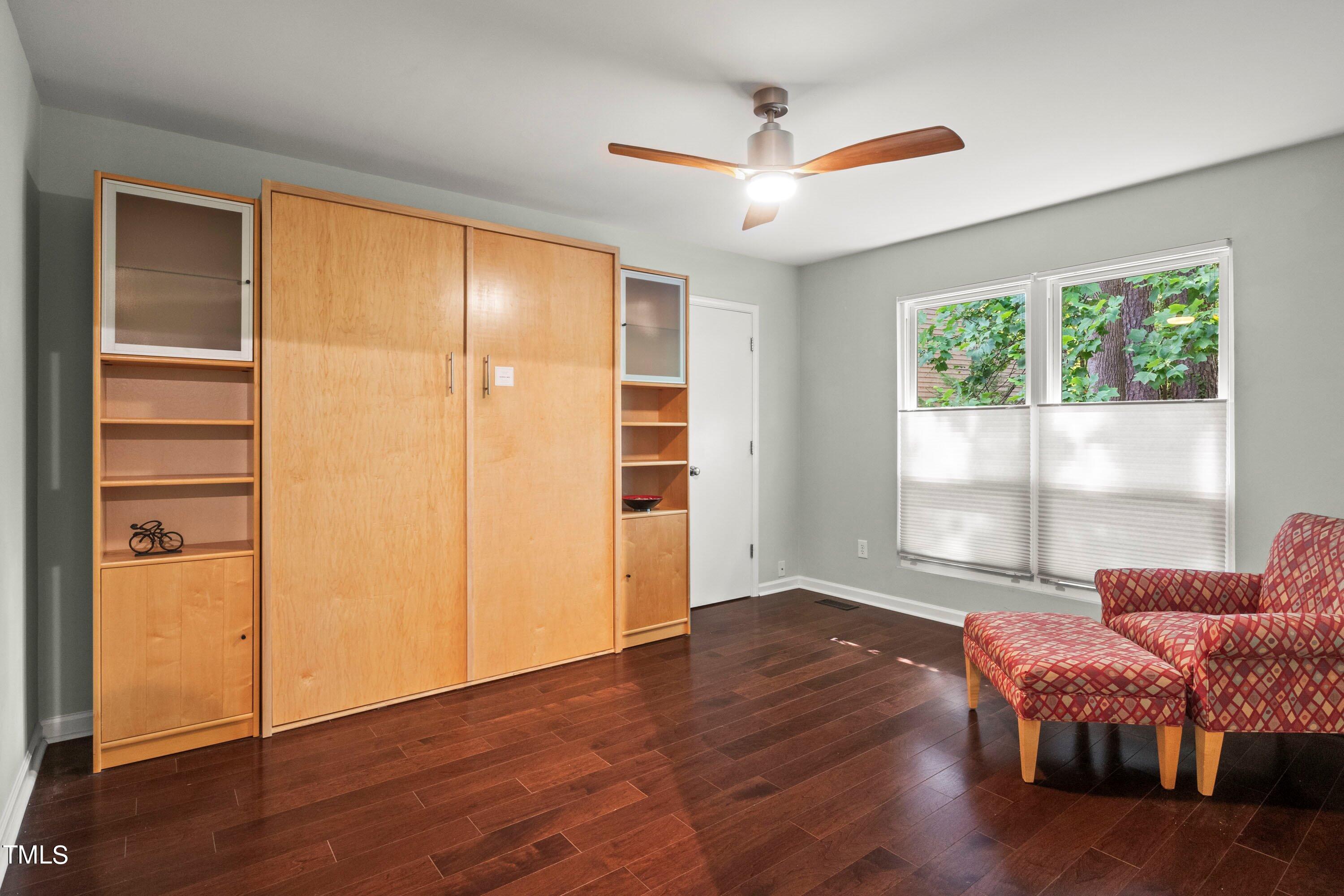 2762 Rue Sans Famille Raleigh, NC 27607 - Photo 25 of 35 a living room with a bed furniture and a window