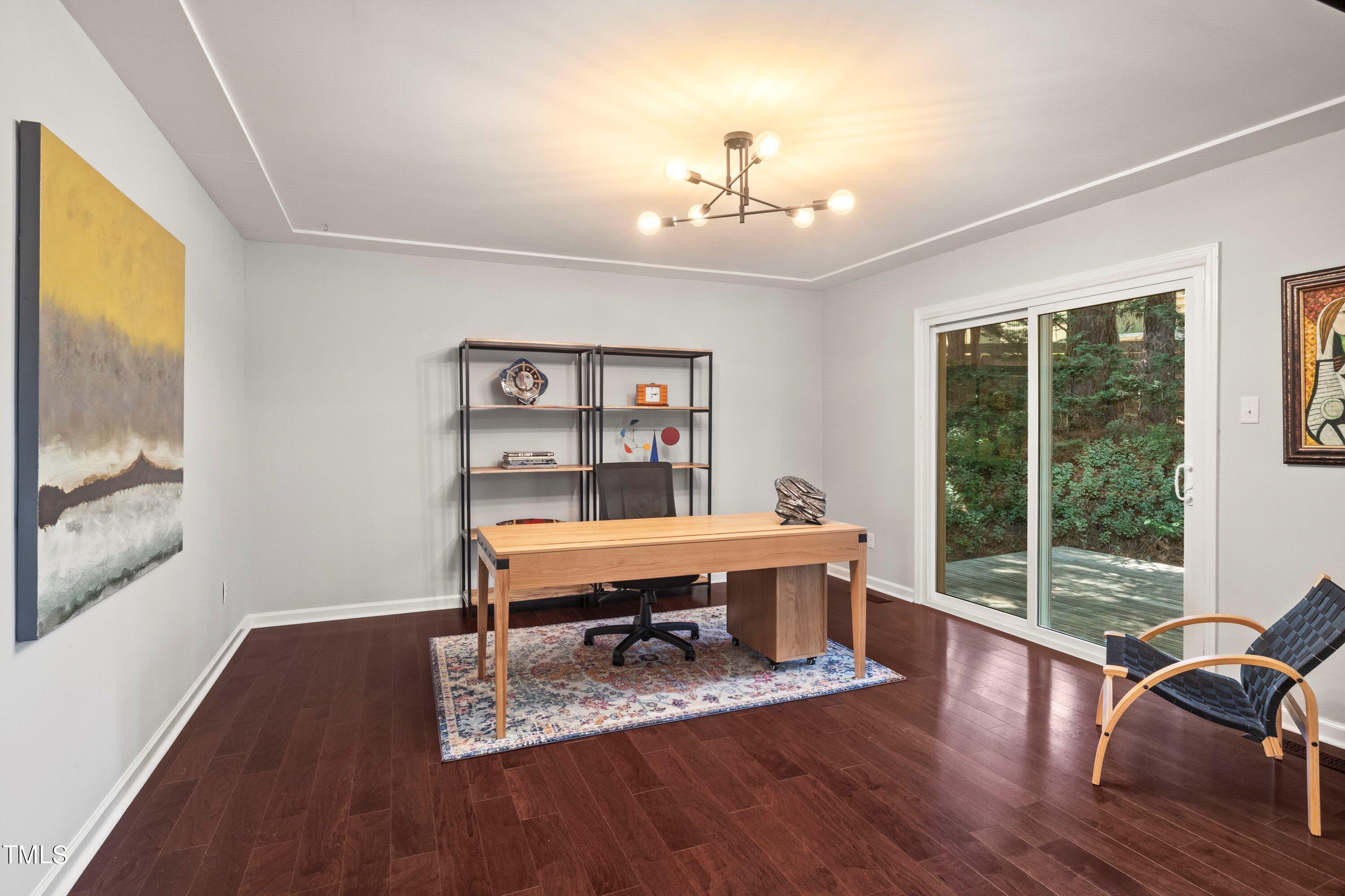 2762 Rue Sans Famille Raleigh, NC 27607 - Photo 29 of 35 a view of a workspace with furniture and a window
