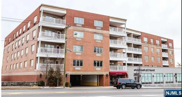 a front view of a building with a street