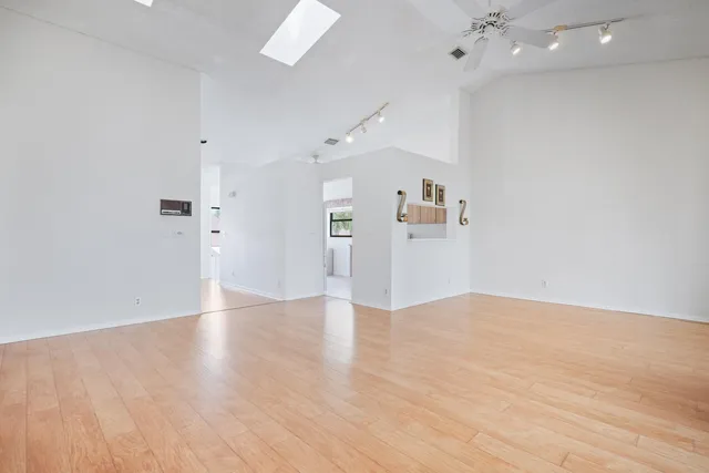 a view of an empty room with a window