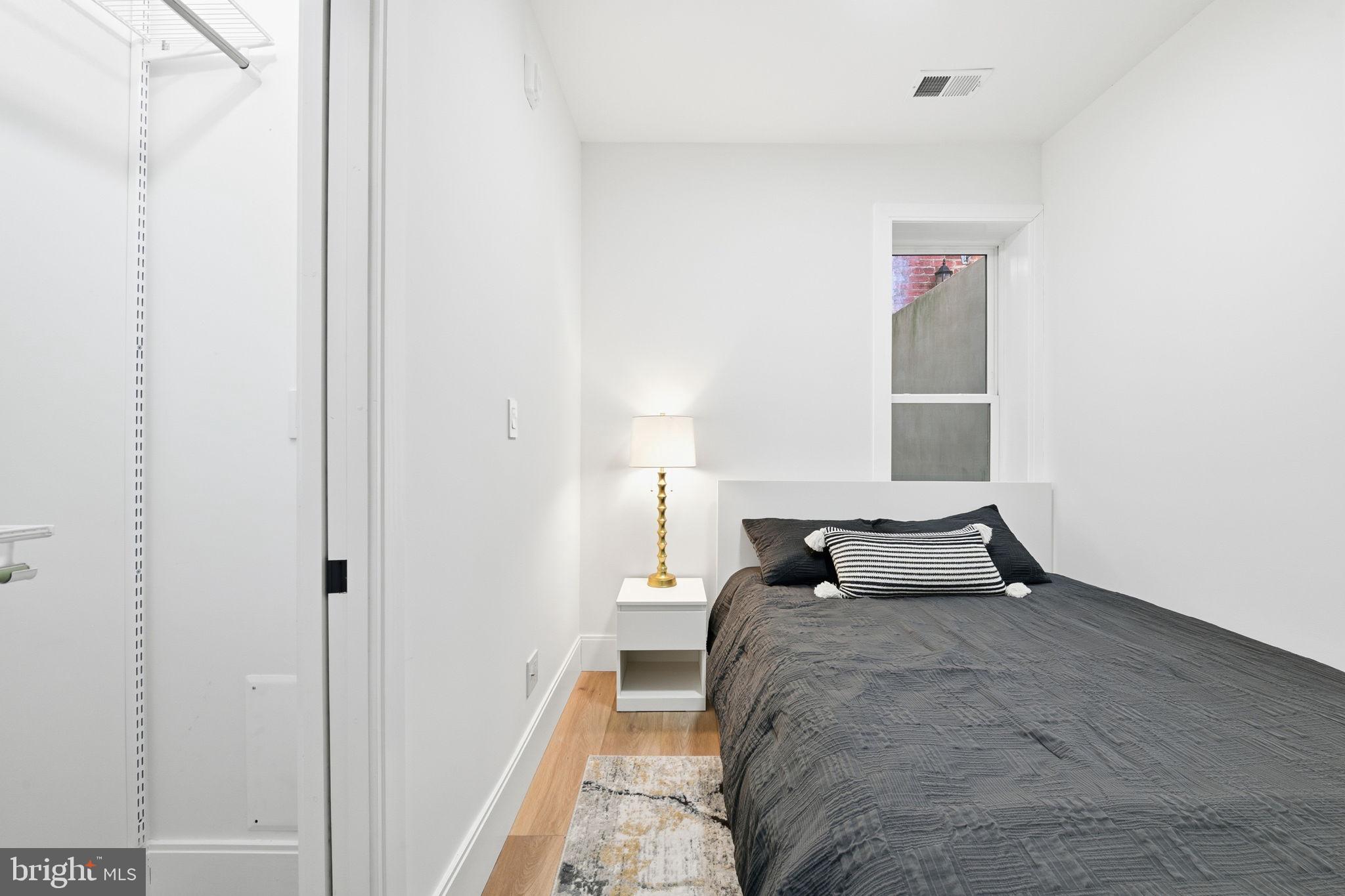 1714 Euclid Street Northwest, Unit 2 Washington, DC 20009 - Photo 14 of 20 a bedroom with a bed and a window