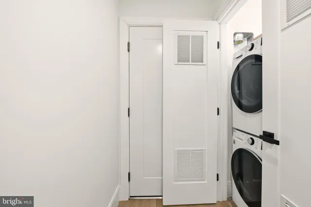 a view of a hallway with washer and dryer