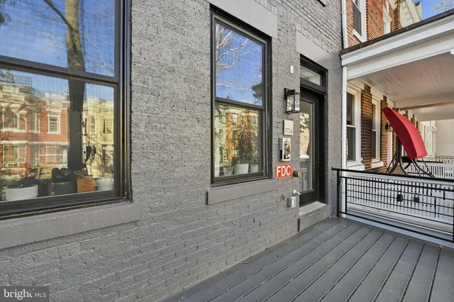 a view of front door of house with stairs