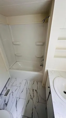 a bathroom with a sink and a bathtub