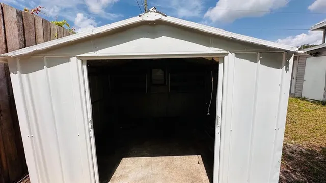 view of a room with a sink and cabinets