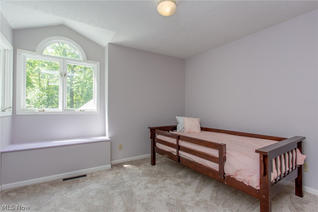 12427 Sperry Road Chesterland, OH 44026 - Photo 28 of 35 Bedroom Two - Spacious layout, beautiful windows, and a window seat with hidden storage