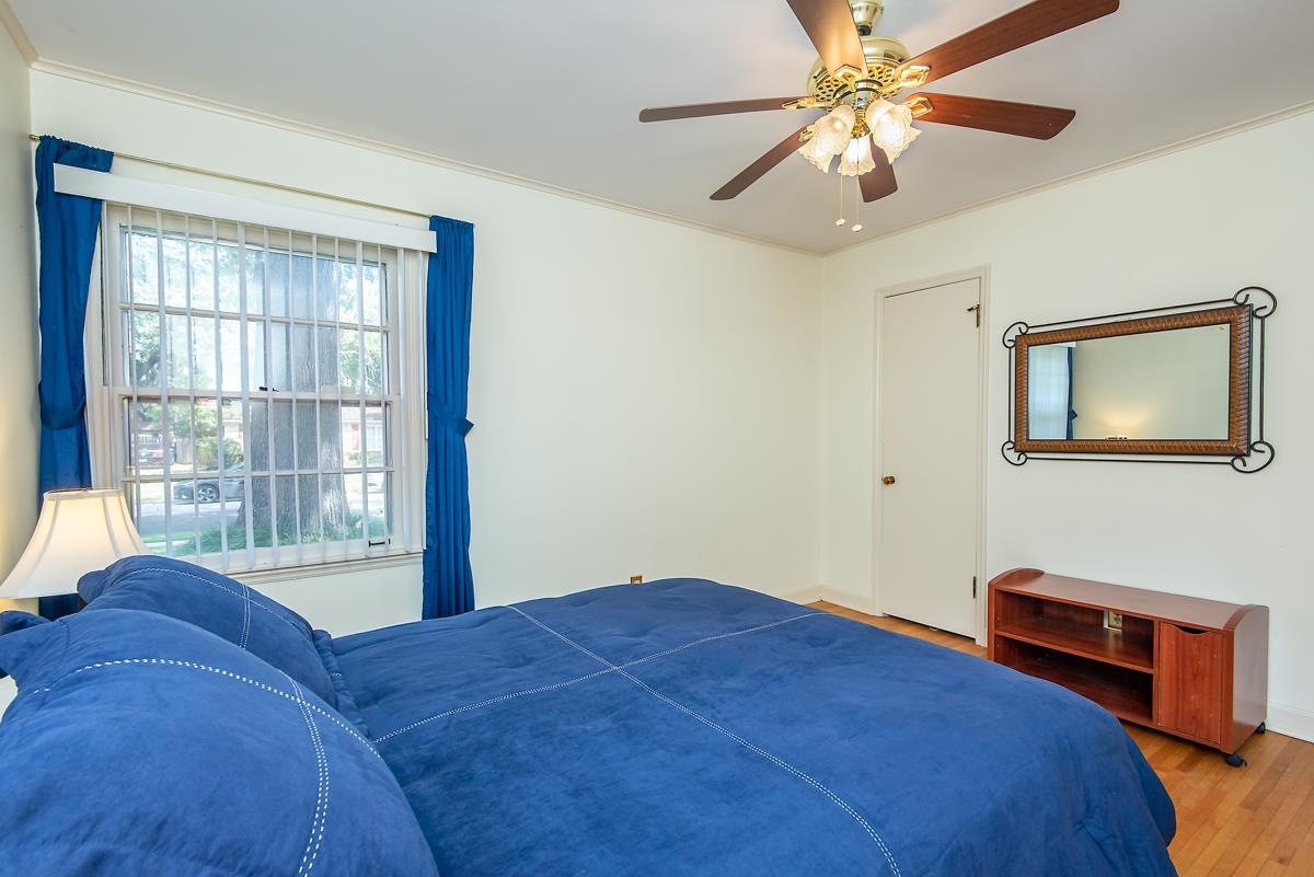 4635 Boyce Road Memphis, TN 38117 - Photo 13 of 19 a bedroom with a bed and a chandelier