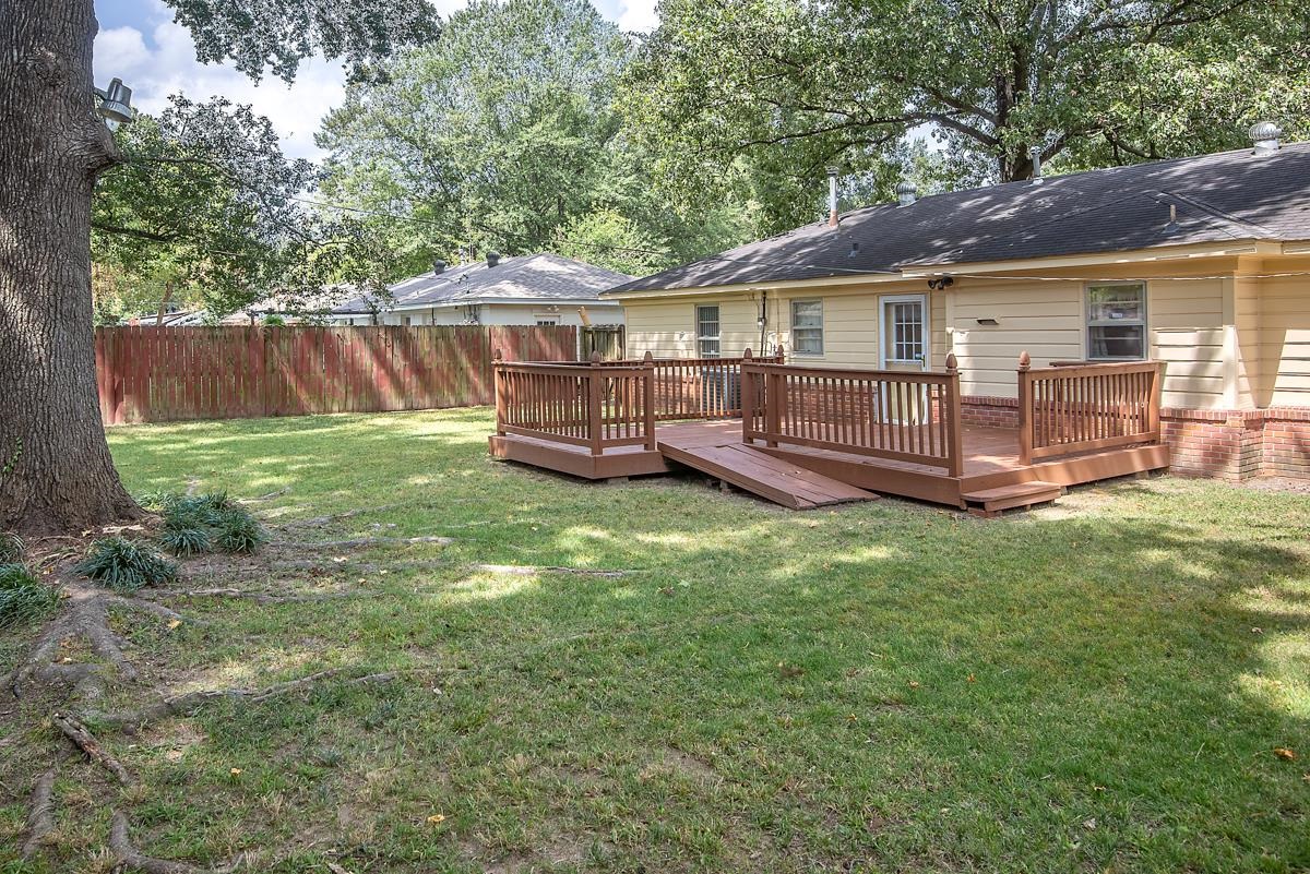 4635 Boyce Road Memphis, TN 38117 - Photo 4 of 19 a view of a house with a yard and deck