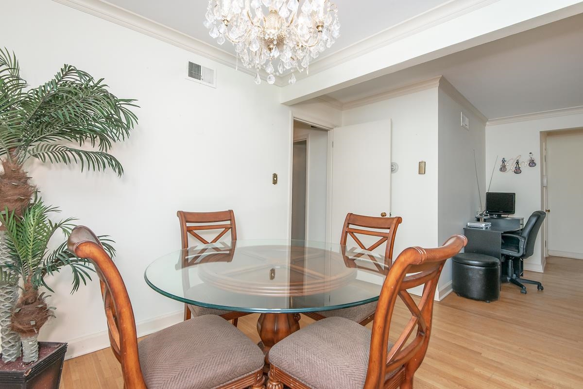 4635 Boyce Road Memphis, TN 38117 - Photo 8 of 19 a view of a dining room with furniture and wooden floor
