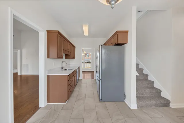 a large bathroom with a tub sink and mirror