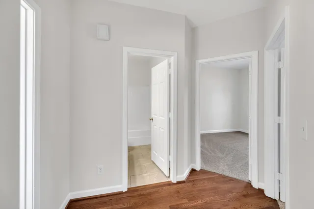 a view of a bathroom with wooden floor