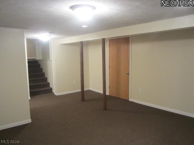 2070 Wyndham Road Akron, OH 44313 - Photo 9 of 17 Recreation room has a half bath to the left.