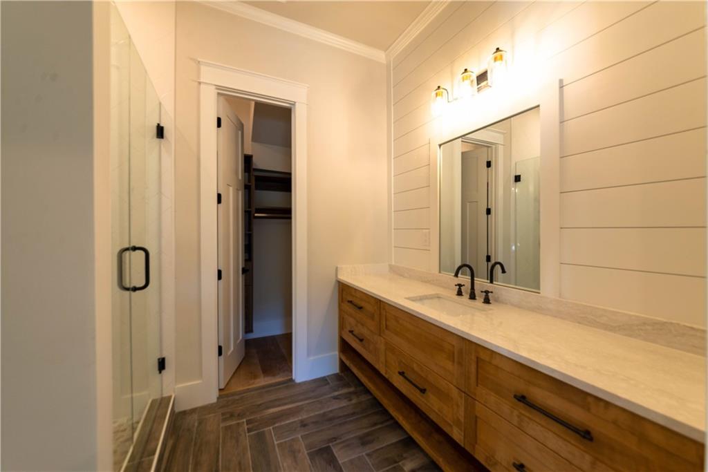 1303 North Druid Hills Road Northeast Atlanta, GA 30319 - Photo 16 of 39 a bathroom with a double vanity sink and mirror