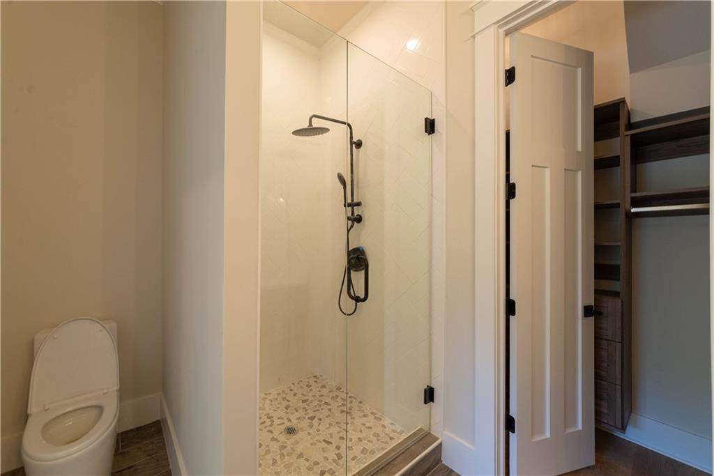 1303 North Druid Hills Road Northeast Atlanta, GA 30319 - Photo 17 of 39 a bathroom with a shower toilet and sink