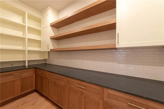 a kitchen with a sink and cabinets