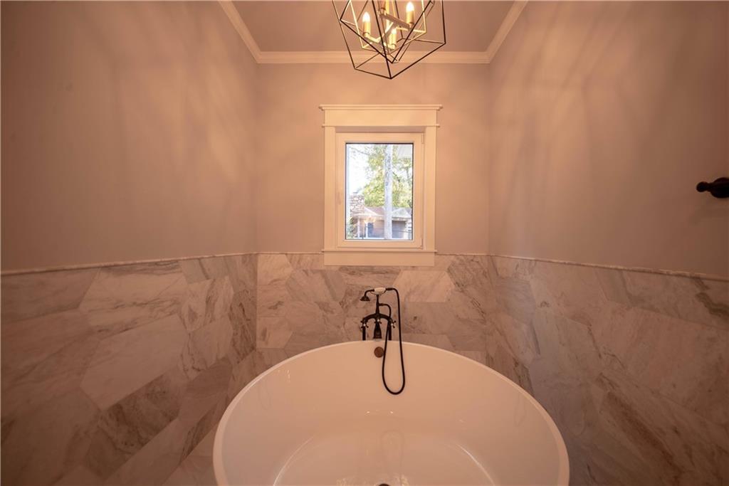 1303 North Druid Hills Road Northeast Atlanta, GA 30319 - Photo 33 of 39 a bathroom with a sink and a window