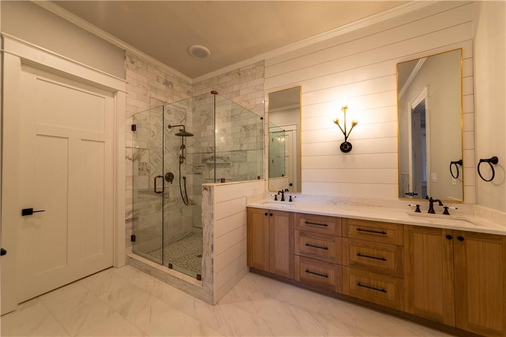 1303 North Druid Hills Road Northeast Atlanta, GA 30319 - Photo 34 of 39 a bathroom with a double vanity sink mirror and shower