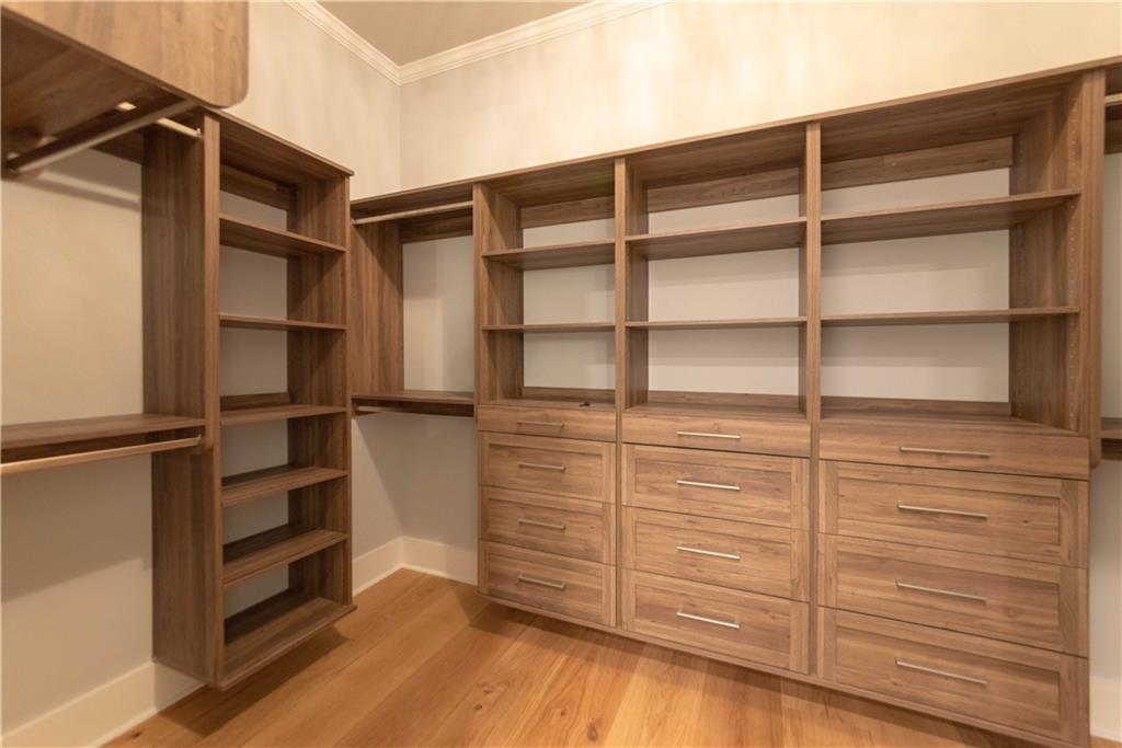 1303 North Druid Hills Road Northeast Atlanta, GA 30319 - Photo 35 of 39 a view of walk in closet with empty racks