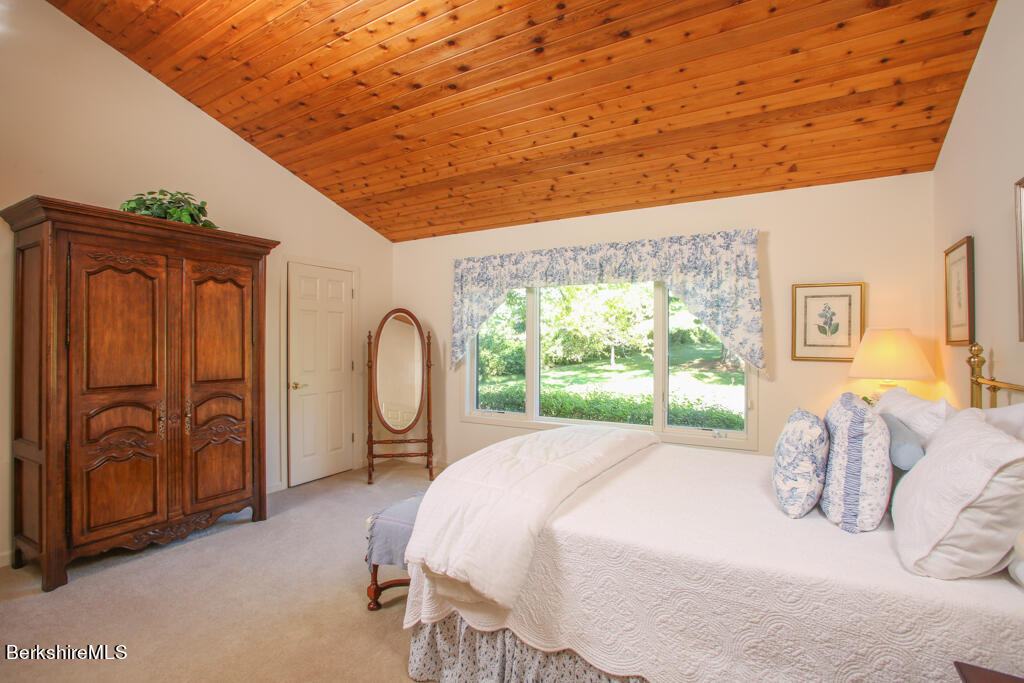 37 Kalliste Hill Great Barrington, MA 01230 - Photo 12 of 26 a bed sitting in a bedroom next to a window