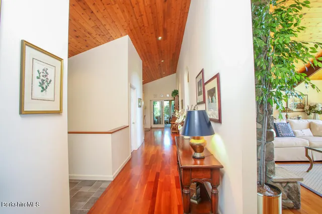 a view of living room with furniture and wooden floor
