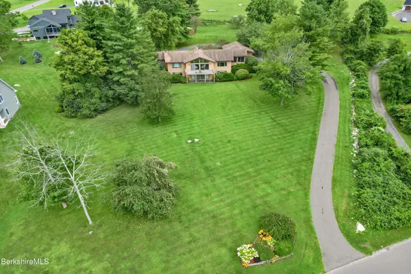 a view of a golf course with a house