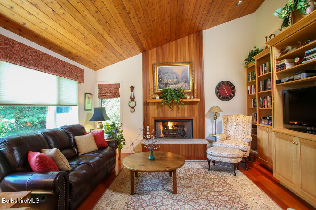 37 Kalliste Hill Great Barrington, MA 01230 - Photo 9 of 26 a living room with furniture a flat screen tv and a fireplace