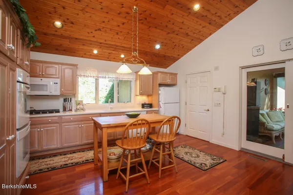 a kitchen with stainless steel appliances granite countertop a stove and a refrigerator