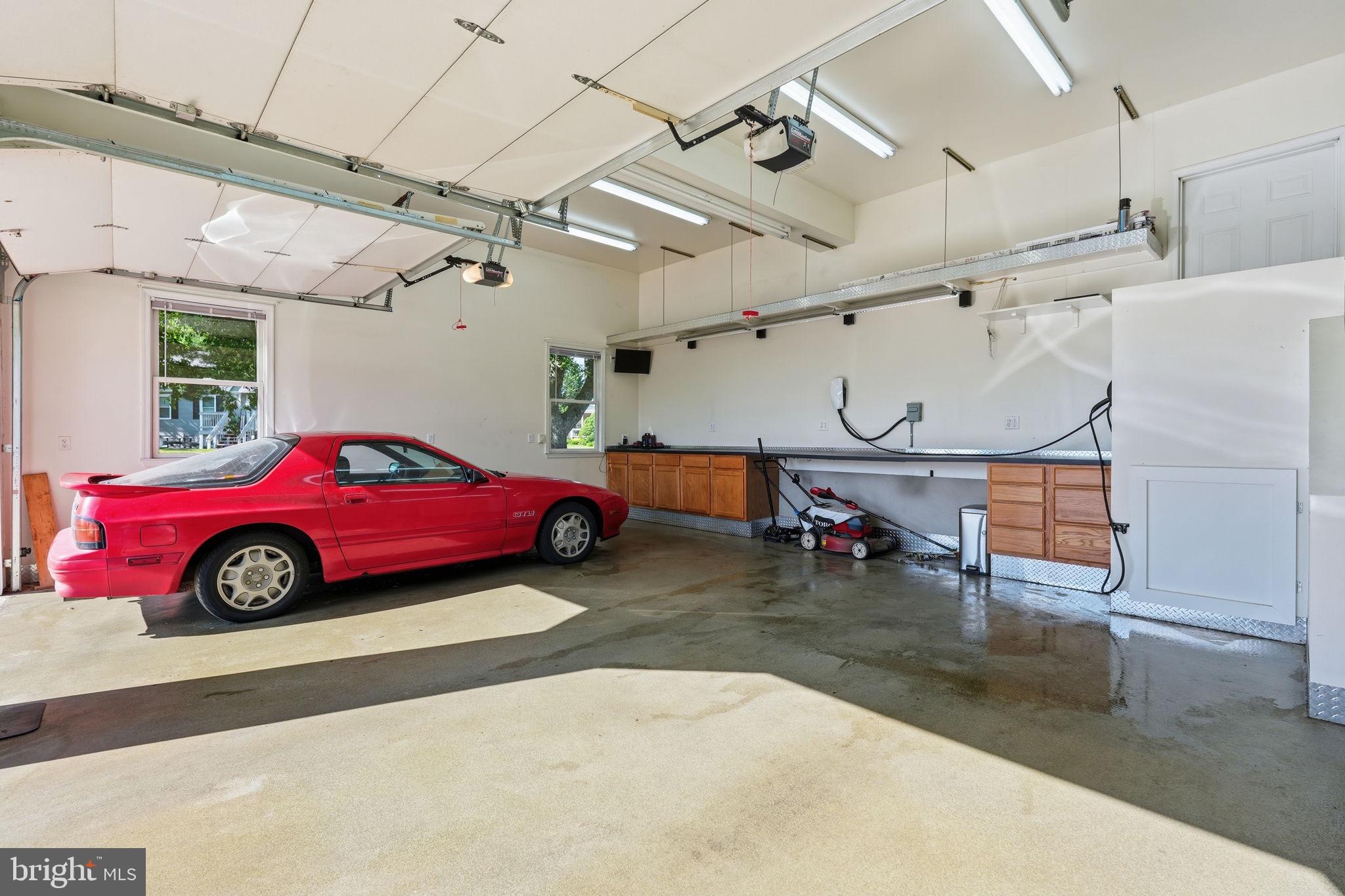 8418 Geneva Road Pasadena, MD 21122 - Photo 28 of 39 Extra Large Garage w/Tesla EV Charger & Work Shop