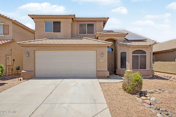 a front view of a house with a garage