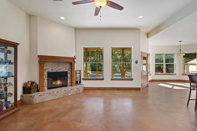 a living room with furniture ceiling fan and a rug