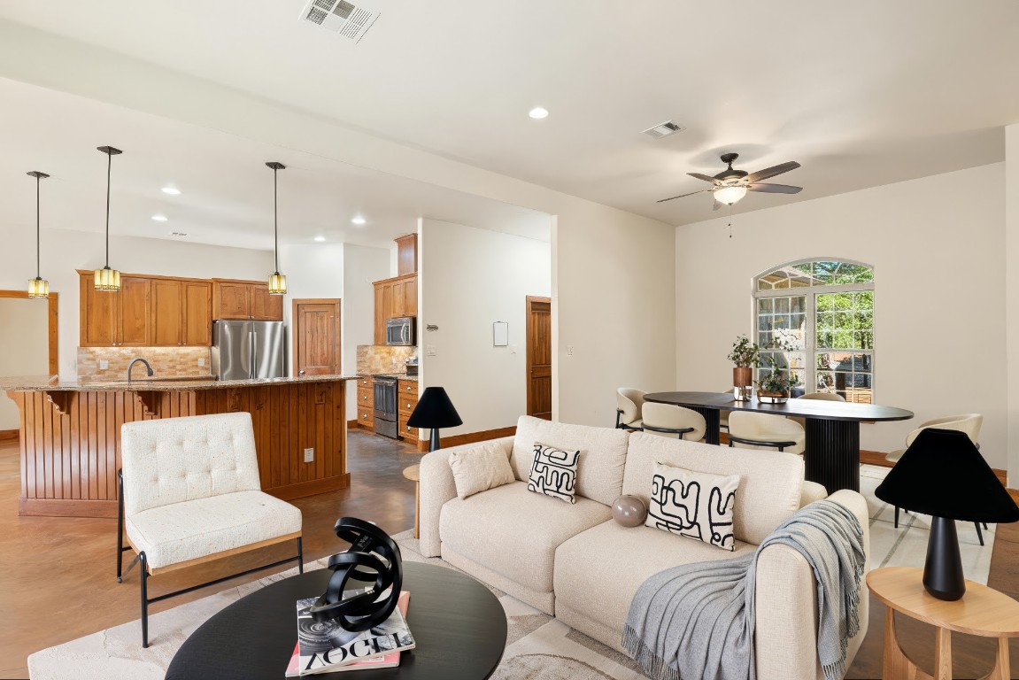 267 Corral Road Smithville, TX 78957 - Photo 12 of 40 a living room with furniture ceiling fan and a rug