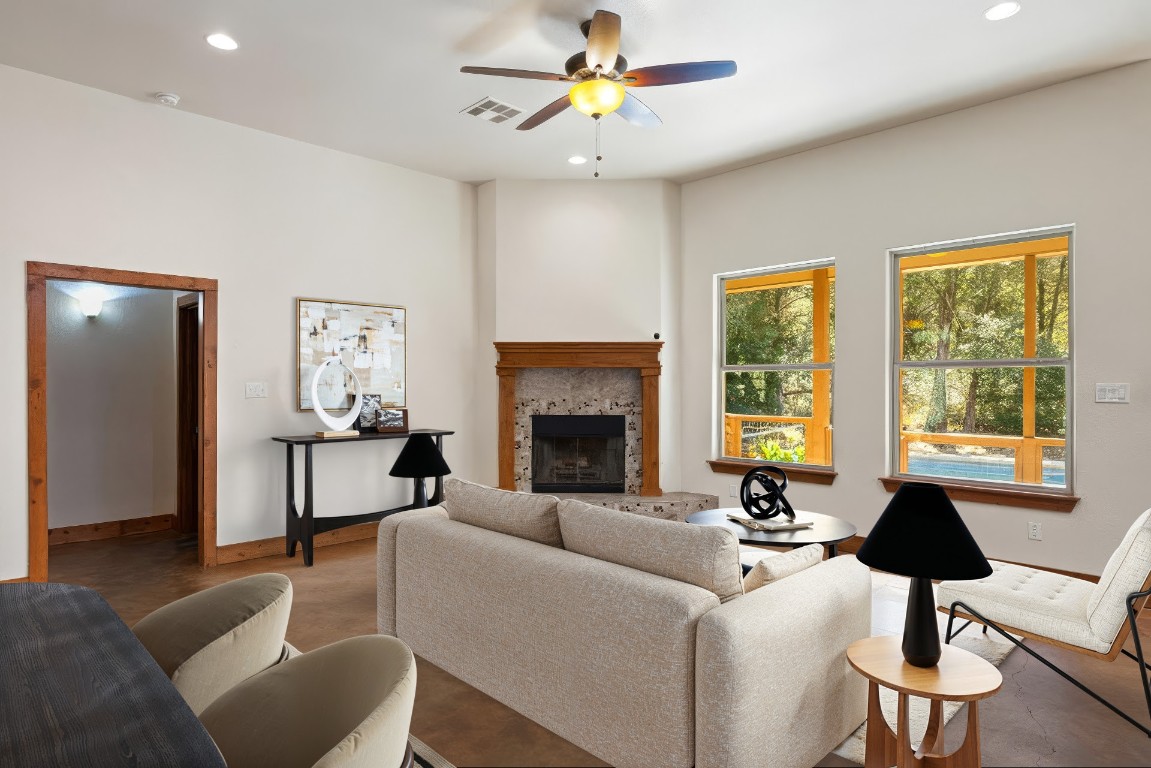 267 Corral Road Smithville, TX 78957 - Photo 13 of 40 a living room with furniture and a fireplace