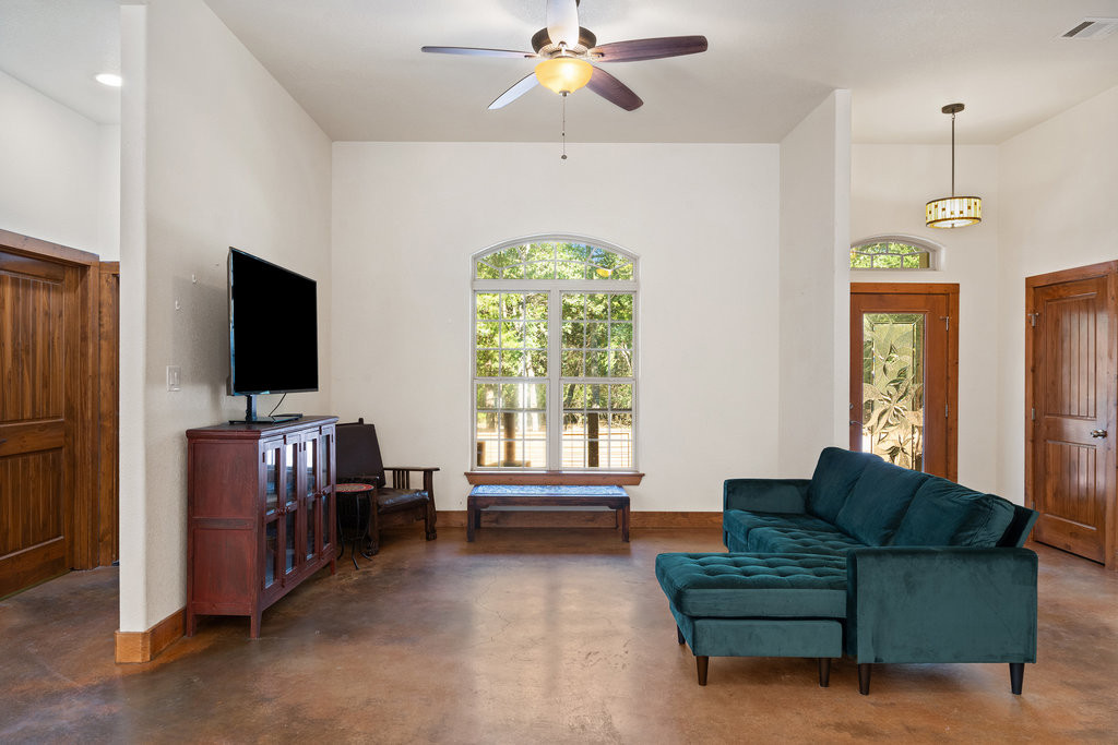 267 Corral Road Smithville, TX 78957 - Photo 15 of 40 a living room with furniture and a flat screen tv
