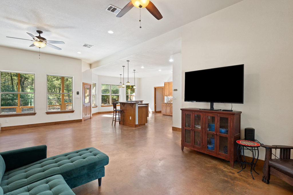 267 Corral Road Smithville, TX 78957 - Photo 17 of 40 a living room with furniture and a flat screen tv