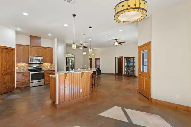 a kitchen with a stove and a cabinet