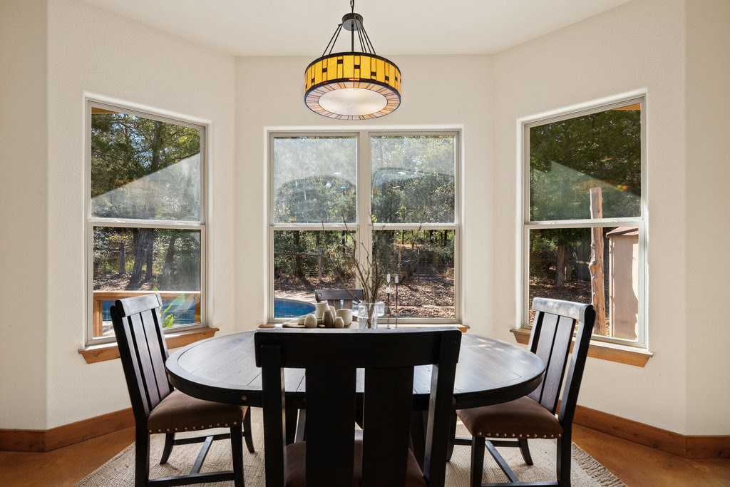 267 Corral Road Smithville, TX 78957 - Photo 23 of 40 a view of a dining room with furniture window and wooden floor