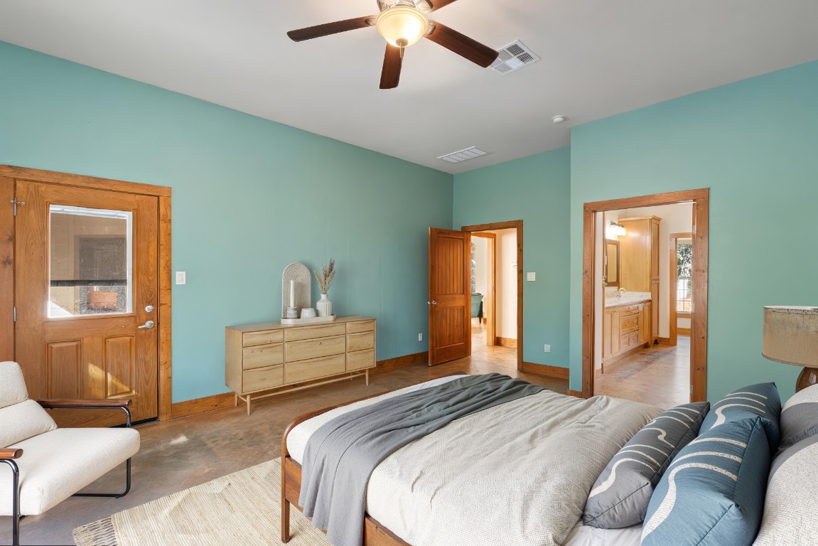 267 Corral Road Smithville, TX 78957 - Photo 26 of 40 a bedroom with a bed and ceiling fan