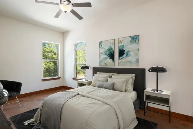 a bathroom with a granite countertop sink a toilet a mirror and shower